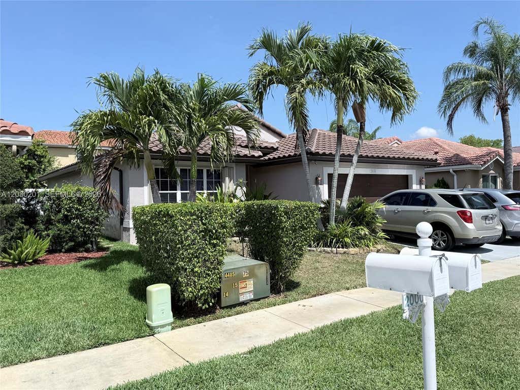 Photo of 2010 NW 182nd Ter, Pembroke Pines, FL 33029 (MLS # A12030201)