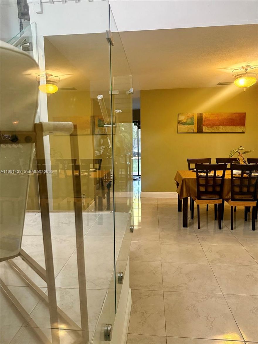 Beautifully maintained 3/2.5 home in the sought after Lakes of the Meadows community! Features a desirable split floor plan with the primary suite on the first floor with easy maintenance all tile flooring. Upstairs boasts engineered hardwood floors, 2 generously sized bedrooms and a loft living room w/impact windows, can convert to 4th room or use as an office or guest space. Home is enhanced by an 8 y/o roof and AC for peace of mind. Step outside to a tropical oasis backyard w/lush landscaping, cozy nook ideal for relaxing or entertaining; plenty of room for a pool. Resort style amenities include clubhouse, pools, gym, sauna, basketball, racquetball, baseball, tennis, and more for a low HOA Must See. Owner/Agent Occupied.