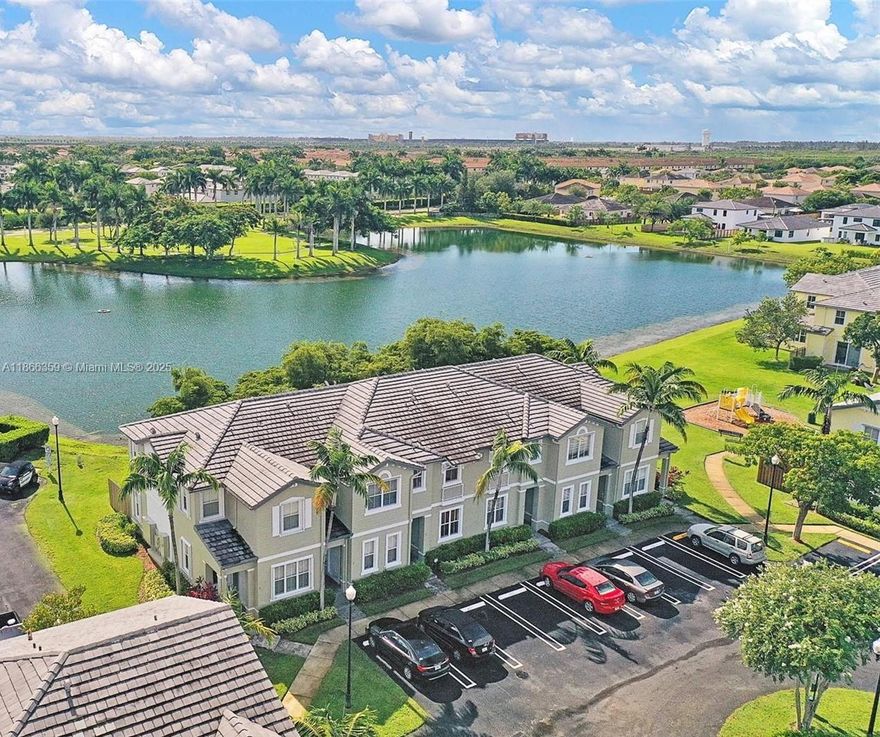 Amazing 3/2.5 Corner Unit Townhouse with Lake View! tile throughout and excellent maintenance. Equipped with accordion shutters, a washer & dryer inside, and stainless-steel appliances. The kitchen has been fully renovated with quartz countertops, wood cabinets, marble backsplash, and a modern stainless-steel sink & faucet. Both bathrooms are also upgraded with quartz countertops, ceramic sinks, cabinets, and AC. Upstairs. Elegant porcelain flooring. Enjoy the paved patio with a storage room. The community offers resort-style amenities, including a clubhouse, gym, great pool, children’s pool, jacuzzi, sauna, playground, and more. Located in the desirable Fiji at Isles at Oasis, a gated community close to the Turnpike, Baptist Hospital, shopping centers, schools, restaurants, and more!