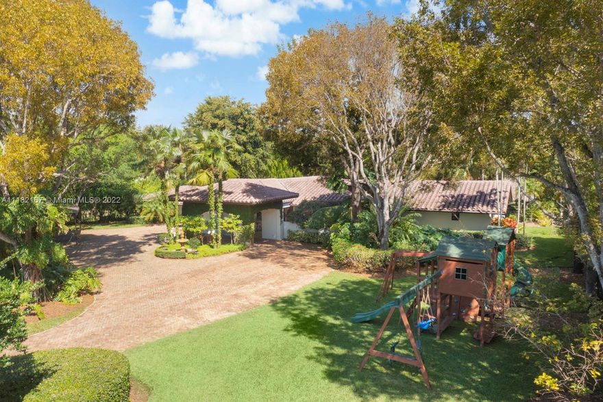 Beautifully updated 6 bedroom 5 bath fully gated and secluded corner acre home in the heart of East Pinecrest.  Picturesque and elegant family home with loads of charm and space for formal and informal living, both inside and out.  Strong sense of style along with beautiful vistas make it feel like you have escaped to Tuscany.  Redone plumbing, all impact glass, fabulous updated gourmet kitchen, gym/office, gorgeous tropically planted pool-patio-yard + basketball/pickleball court.  Top of the line detailing and upgrades throughout. Porte-cache + 3-car carport,  inviting and lush front dining courtyard.  All of the best schools in Pinecrest.