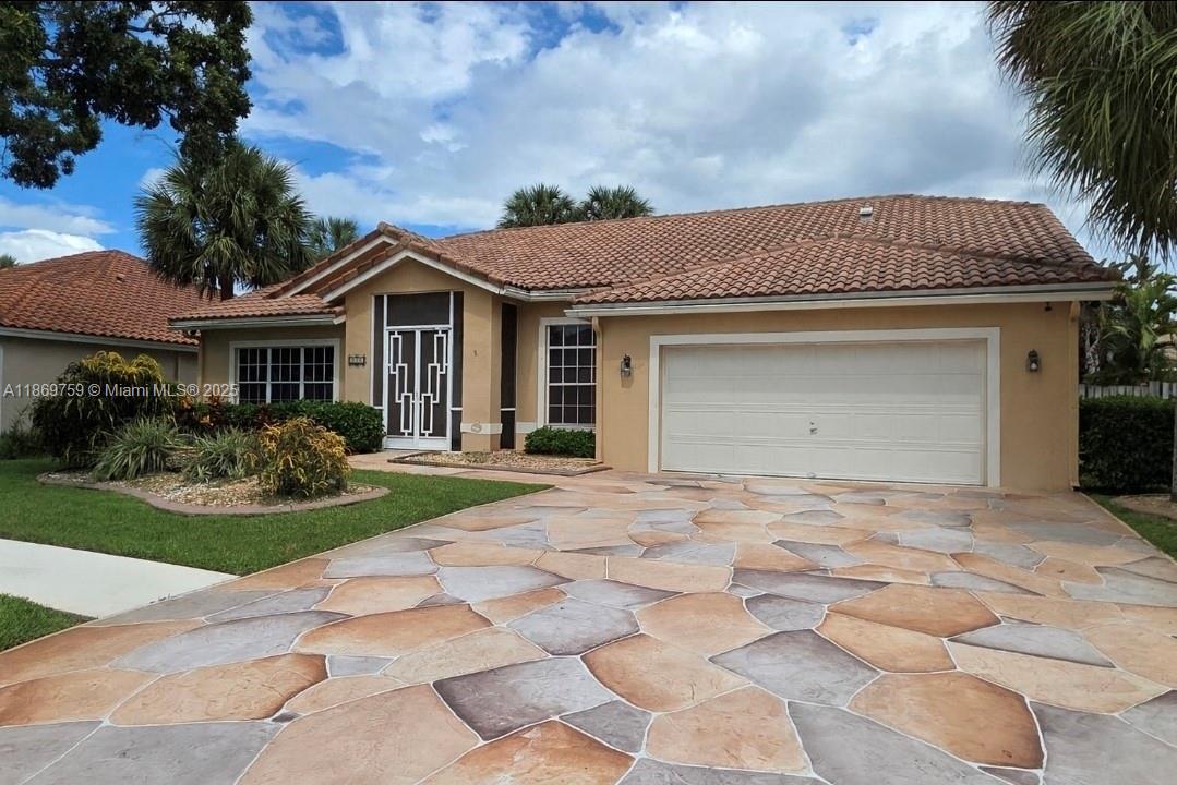 Discover this well-maintained, spacious with tall ceilings, natural light residence in the heart of Lauderhill - 4 bedrooms + den and 2.5 bathrooms. Step inside to find a bright living area that flow seamlessly into the dining and kitchen spaces - ideal for both: entertaining and everyday living. The kitchen filled with plenty of counter space. The bedrooms are generously sized with great closet space, while the primary suite offers privacy and comfort. Outside enjoy the Florida living at its best with plenty of space for a pool, gatherings, gardening or simply relaxing in the sunshine under screened in patio. Additional highlights: gated quiet community with plenty of parking space in a driveway, close proximity to schools, shopping, dining, major hways.
