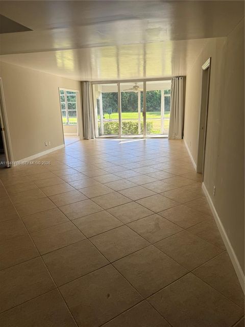 Photo of 4007 N Cypress Dr #104, Pompano Beach, FL 33069 (MLS # A11941786)
