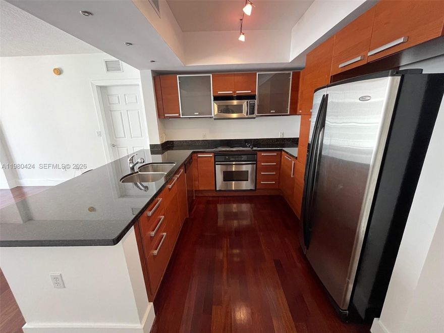 Beautiful 2 bed / 2 bath condo unit for sale at The Minorca in Coral Gables. Built in 2005. Huge 2/2 split floorplan unit. Wood floors and carpets in bedrooms. California closets, European kitchen, W/D inside unit. Comes with 2 assigned car spaces in tandem. Balcony overlooks the courtyard area. This building features security at front desk, event room and gym. Basic cable included. Walk to Miracle Mile and enjoy Downton Coral Gables!!! EASY TO SHOW.  LISTING OFFICE LOCATED AT THE MINORCA CONDO.