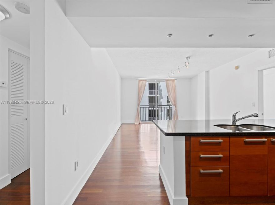 The Minorca Cond best price in building!!!!!!!!!!!! 4 blocks  to Miracle Mile.
 Built in 2005. Huge 2/2 split floorplan unit.
 Wood floors and carpets in bedrooms. California closets, European kitchen, W/D inside unit. Comes with 2 assigned car spaces in tandem. Balcony overlooks the courtyard area. This building features security at front desk, event room and gym. Basic cable included. Enjoy Downton Coral Gables!!! EASY TO SHOW.  LISTING OFFICE LOCATED AT THE MINORCA CONDO.
READ BROKERS REMARKS FOR SHOWINGS.