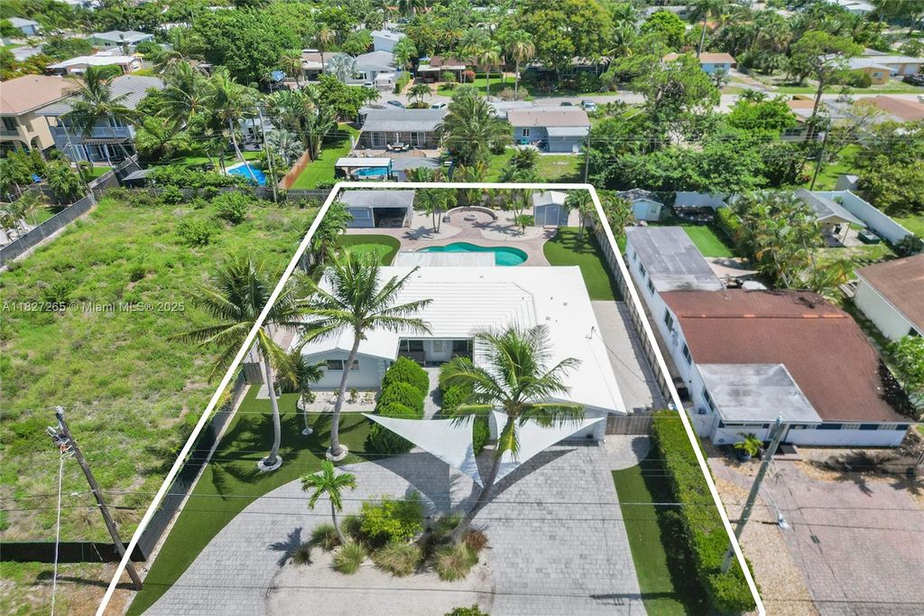 Photo of 1555 NE 35th St, Oakland Park, FL 33334 (MLS # A11827265)