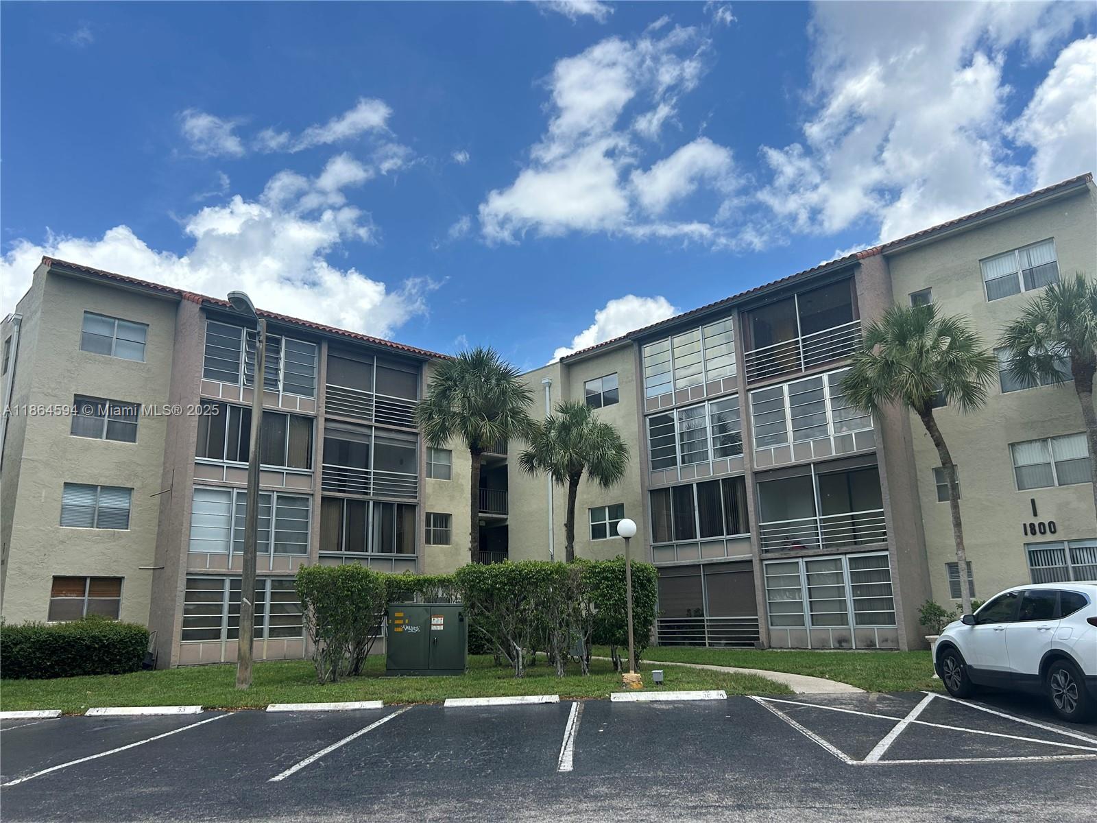 Spacious 2BR/2BA condo in the well-maintained, gated Courtyards of Broward community with elevator access, water and cable included. The unit features tile floors throughout, updated bathrooms, a bright eat-in kitchen, and a screened balcony overlooking lush green courtyards, garden paths, and the serene pool with fountain. Enjoy resort-style common areas including a clubhouse, fitness center, tennis courts, billiard/gameroom, community library, and secure on-site management. Conveniently located just steps from Publix, local shopping centers, parks, top schools, colleges, University Hospital, and major highways—perfect for families, professionals, or retirees seeking a comfortable and convenient lifestyle. No pets allowed.