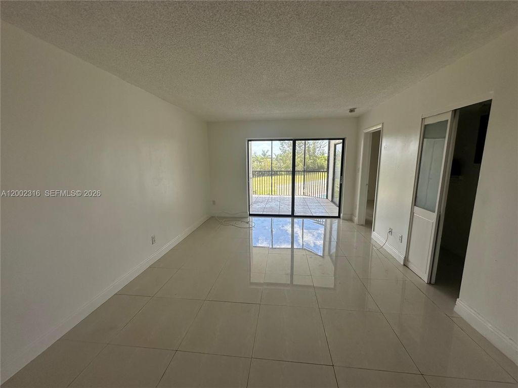 Photo of 3396 Foxcroft Rd #305, Miramar, FL 33025 (MLS # A12002316)