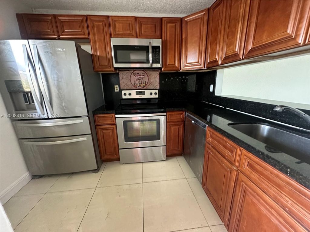 Photo of 3396 Foxcroft Rd #305, Miramar, FL 33025 (MLS # A12002316)