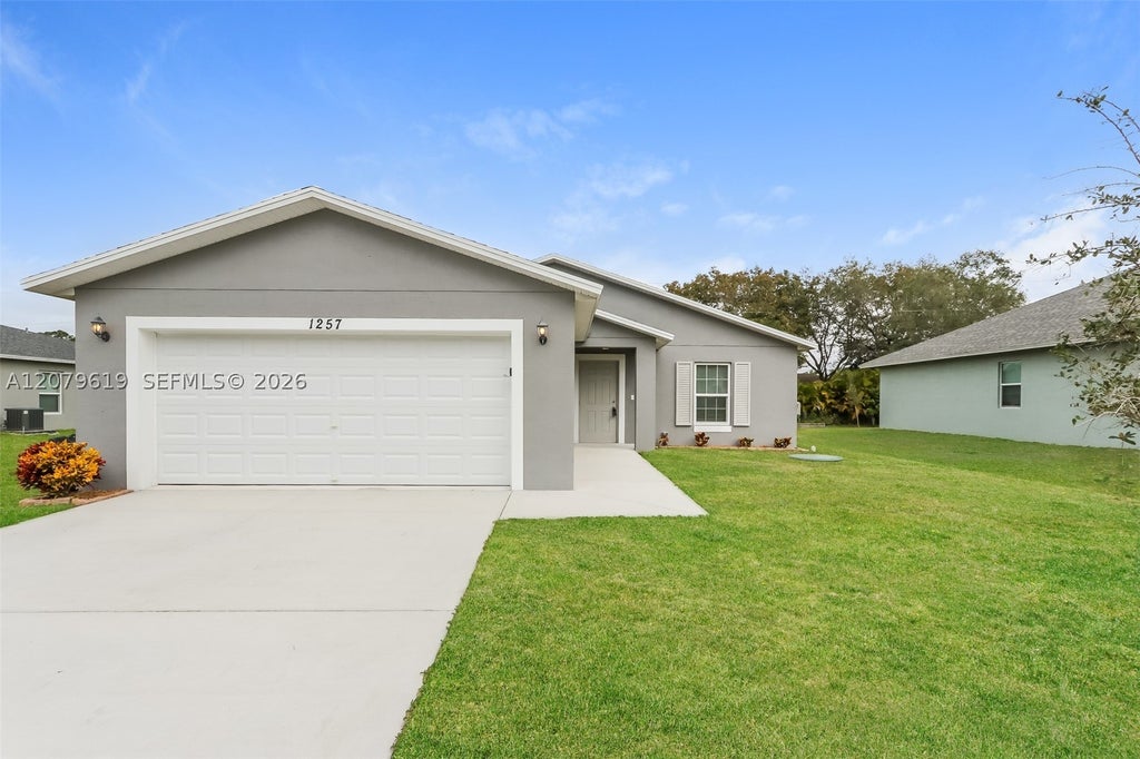 Photo of 1257 SW Century Ave, Port St Lucie, FL 34953 (MLS # A12079619)