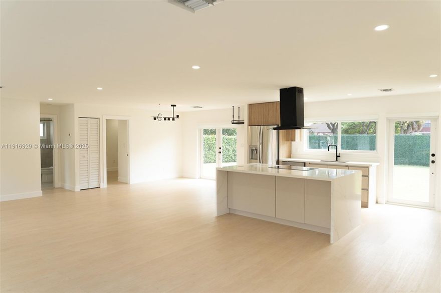 Welcome to 14868 SW 71st Ln - your move-in-ready family friendly West Kendall gem! Fully remodeled in 2024, this bright 3-bed, 2-bath home shines with a brand-new roof, impact windows & doors, gourmet kitchen w/quartz counters & stainless steel appliances, updated bathrooms, and wood laminate flooring throughout. Sitting on a huge 8,250 sq ft corner lot with plenty of room for your future pool, summer kitchen, and backyard oasis. Perfect starter home for a growing family in a quiet, family-oriented neighborhood near A-rated schools, parks, shopping, and quick highway access. Ideal for families seeking comfort, style and growth. Low maintenance living with high-end finishes - just unpack and enjoy the Miami lifestyle! Don't miss this gem - come see it today!