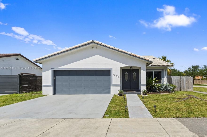 Charming 3-bed, 2-bath home in a lovely neighborhood with no HOA! Bright, open layout connects living, dining, and kitchen — great for entertaining. The primary suite offers patio access, a makeup vanity, large walk-in closet, and a bath with double vanities and soaking tub. One guest room also has a walk-in. Fresh interior paint, new AC, 2-car garage, and impact windows throughout — except for the sliding doors. Enjoy a fully fenced yard with a covered patio, plus the backyard’s banana tree, fondly named Miriam, bringing a touch of tropical charm.