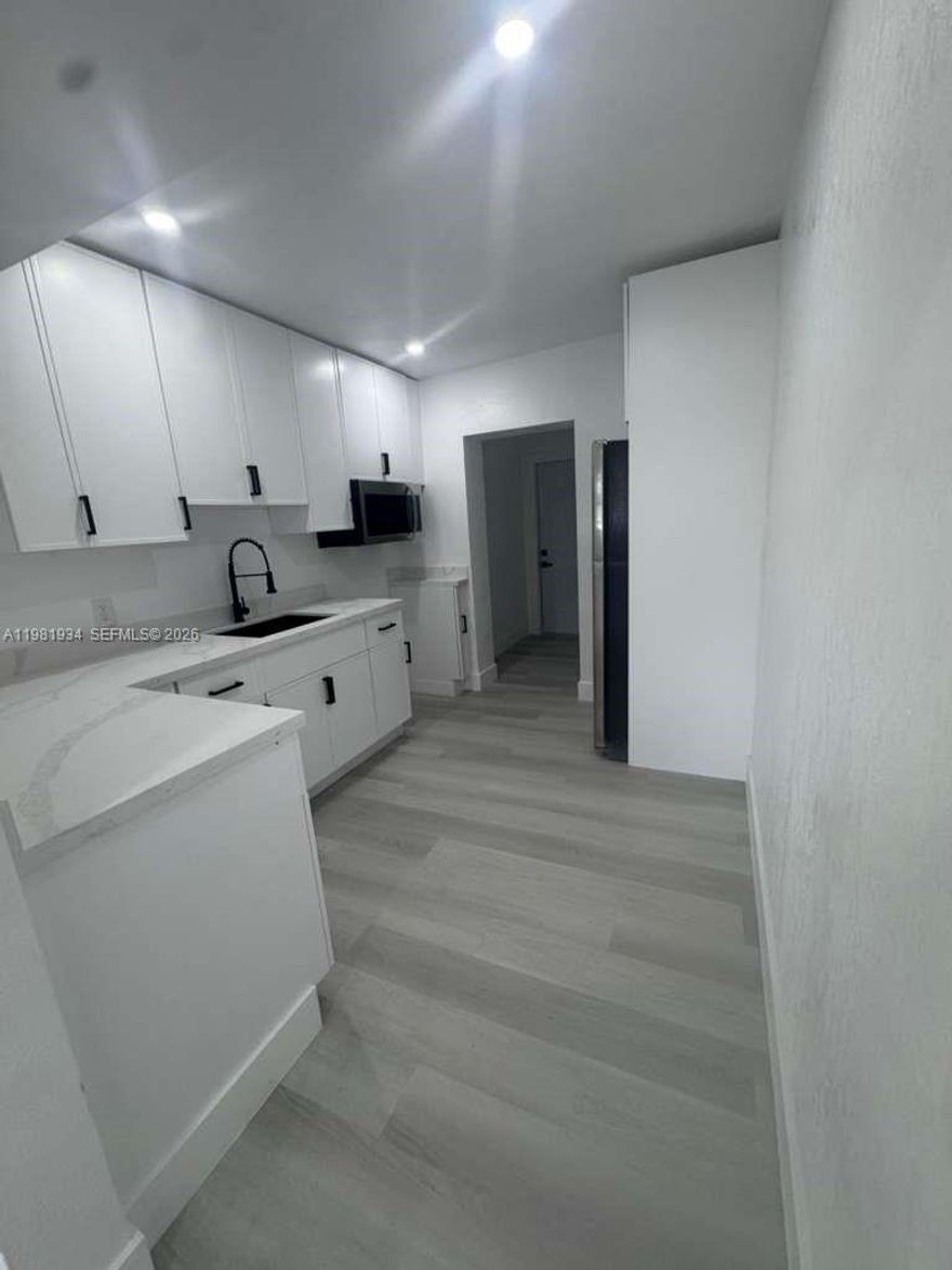 Fully remodeled home with major upgrades already completed! Features a new permitted roof, impact windows, brand-new electrical system, new A/C with updated ductwork, and a recently serviced septic tank (receipts available). The property offers a flexible layout with excellent potential to create a duplex-style setup or additional income-producing space, with much of the work already underway. Plus, an additional space that can be used as an office or den. Move-in ready with valuable upgrades throughout. Buyer incentives available when closing with our preferred lender.