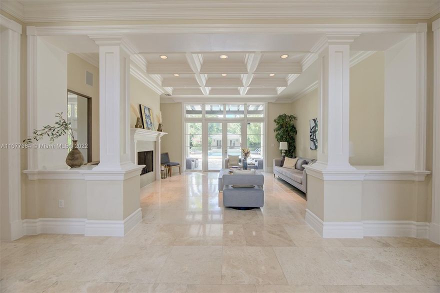 Enchanting custom built 1 acre estate in Pinecrest. The elegant grand foyer leads to a beautiful formal living room. The extensive living areas are perfect for hosting and the stunning kitchen includes Wolf brand double oven gas range with 8 burners, Miele appliances, floor to ceiling cabinetry, 1,000 bottle glass enclosed wine cellar, and a breakfast bar area. The master bedroom suite offers a welcoming sitting area, walk-in closets, spa bath with whirlpool tub and shower, and a private terrace overlooking the estate. The property also features a covered terrace with a summer kitchen, custom pool, & guest house. Additional features:  elevator, staff quarters, office, impact windows/doors, gate, and 3 car garage.  By Appointment Only.