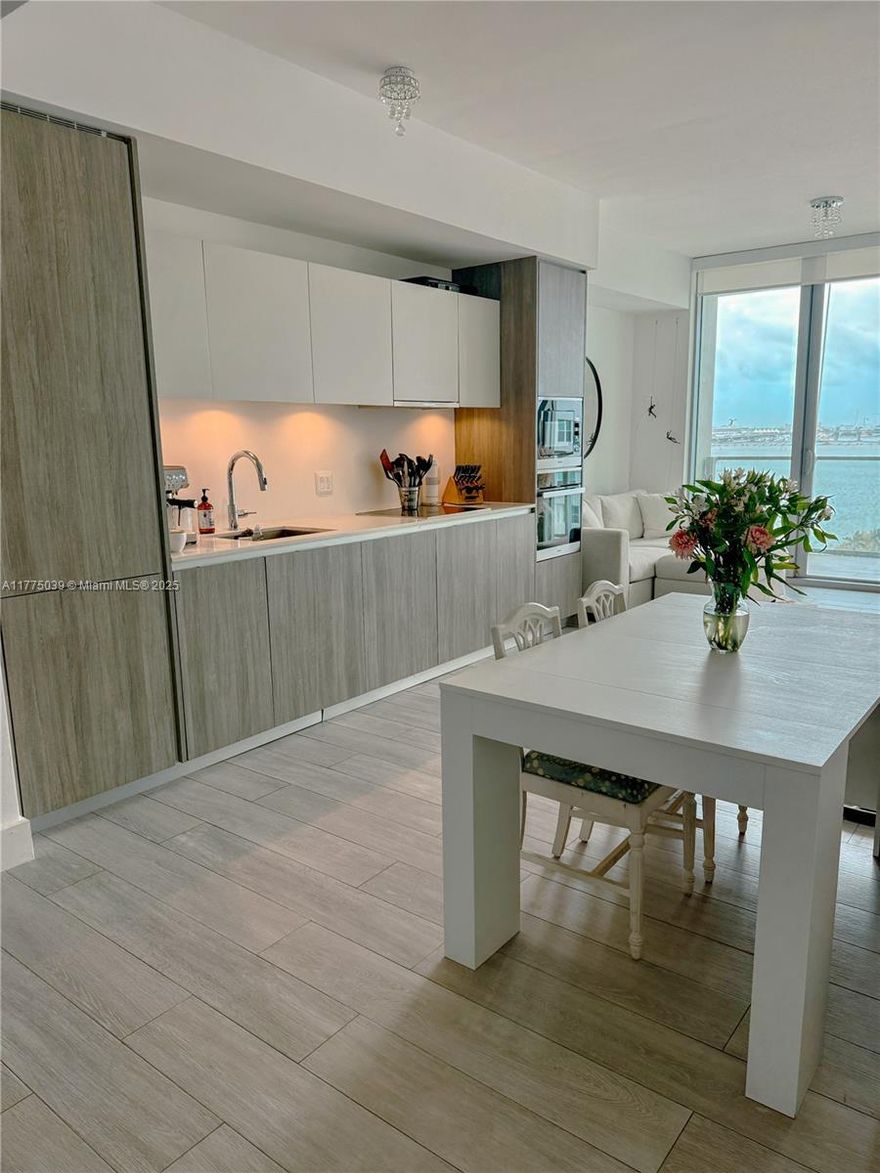 Live the waterfront lifestyle at Biscayne Beach in this spacious 1-bedroom + den, 2-bath unit with stunning bay and city views. Located on the 10th floor, this residence features floor-to-ceiling impact glass, a modern kitchen with Bosch appliances, custom closets, and a private balcony. The den is perfect for a home office or guest space. The unit is partially furnished, offering convenience and comfort. Enjoy luxury amenities: beach club, two pools, tennis courts, gym, spa, valet, and 24-hour concierge. Located in Edgewater, just minutes from Wynwood, the Design District, Downtown, and Miami Beach.