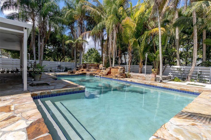 Elegant corner-lot residence in the prestigious Country Walk community, offering privacy, scale, and refined indoor–outdoor living. Built in 1981 and set on an expansive 14,716 SF lot, this 4-bedroom, 4.5-bathroom home spans 3,680 SF of living space and showcases a beautifully resurfaced stone finished pool with elegant fountain feature, new pool pump, and mature mango and avocado trees creating a serene, resort style setting. 

The interior is warm and elevated, featuring sealed pine wood ceilings throughout, ambient lighting, and skylights that flood the home with natural light. A spacious kitchen anchors the home, while a screened outdoor terrace invites effortless entertaining. The primary suite offers a private wellness retreat with an expansive adjoining spa area featuring an integrated sauna, jacuzzi, full bathroom, and dedicated split A/C unit. 

Recent upgrades include a 5-year-old roof and a new TRANE HVAC system with transferable 10-year warranty. Ample parking with a 7-car driveway plus 2-car garage. Miami-Dade Water and Sewer Department has been addressing Country Walk sanitary sewer facilities, providing added infrastructure assurance. 

Low HOA of $176/month includes clubhouse, pool, jacuzzi, tennis, basketball court, and playground. Ideally located near top-rated schools, shopping, and dining.