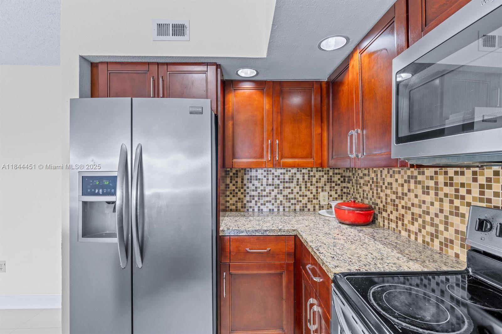 Fully upgraded condo with lake view, porcelain tile floors, and washer & dryer inside the unit. Freshly painted, with wooden kitchen cabinets, top-of-the-line stainless steel appliances, and a spacious walk-in closet. This unit is far superior to others for sale in the community thanks to its high-end upgrades, offering greater comfort, style. Located in a resort-style gated community with 2 heated pools, hot tub/sauna, tennis courts, clubhouse, BBQ area, and gym. Assigned & guest parking. Prime location near Tanger Outlets, CityPlace, I-95, parks, golf, Palm Beach Airport, and just minutes from the beach.