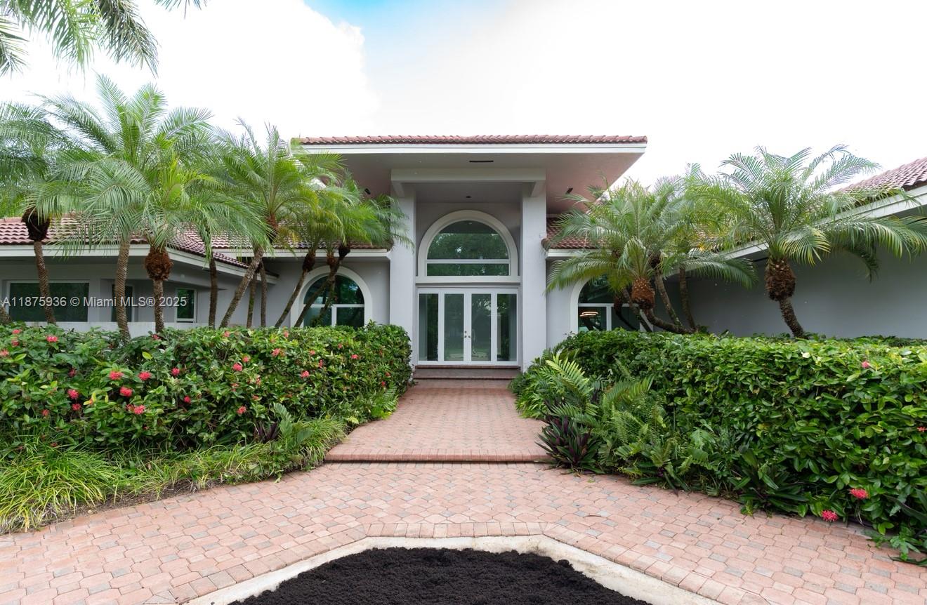 Nestled inside an exclusive upscale gated community, this stunning estate offers the perfect balance of elegance, privacy, and comfort. This residence features 5 bedrooms and 4.5 bathrooms. Step inside to soaring ceilings, sun-filled living areas, and a spacious open floor plan. The primary suite provides a private retreat, complete with spa-inspired bath and generous walk-in closets. Additional bedrooms and bathrooms are thoughtfully designed to offer comfort and functionality for family, guests, or a home office setup. Outdoors, enjoy the ultimate South Florida lifestyle with a sparkling pool, expansive patio, & lush half-acre lot—perfect for entertaining. Located in highly desirable Palmetto Bay, this home offers easy access to top-rated schools, beautiful parks, shopping, & dining.