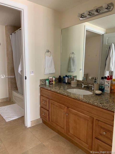 LOCATION LOCATION LOCATION! This modern, comfortably elegant and finely upgraded 2 bed/2 bath unit offers everything you need and ever wanted without any need for upgrades. Located one block from Miracle Mile with easy access to shops and restaurants. 2 covered parking spaces, porcelain tile floors throughout unit, GE stainless steel appliances, imported granite vanity and counter tops, in-unit walk-in storage room, walk-in closets with custom-built cabinetry, over sized laundry room with washer and dryer and custom-built cabinetry, custom-made wooden window treatments, 9 foot ceilings, impact windows, fitness center, pool and many more amenities. Ready to move in!