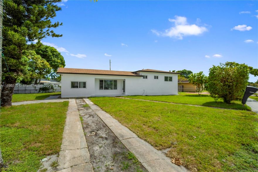 Stunning modern 4-bedroom, 3-bathroom home on a 10,800 sq ft corner lot. This spacious property features a sparkling pool, a lush green backyard, impact windows, and generously sized living areas perfect for entertaining or a growing family. The open-concept layout allows natural light to fill every room, creating a bright and welcoming atmosphere. Ideal for families seeking comfort, style, and outdoor enjoyment in a prime location.