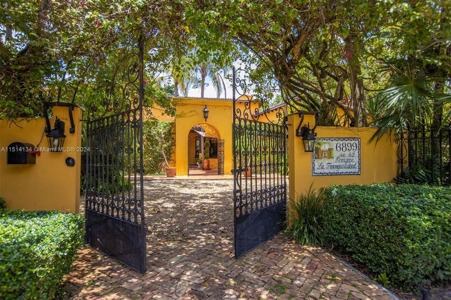 "Welcome to this historic jewel in South Miami, sitting on a 30,056 sq ft lot located in Tranquility Estates (which owes its name to the Tranquility Farm, and this was the main house). The current owners have meticulously maintained and improved their home over the 26 years. It includes 5 bedrooms, 5 baths, 1 half bath, 1 den, a 4-car garage, many patios, and a pool. The adjusted area is slightly over 5000 sq ft. The iron gates, wrought iron door, floors, and patio fountain were crafted and imported from Mexico, and along with other elements, give this home a ranch feel or 'Hacienda,' making it a unique home to own in South Miami."
