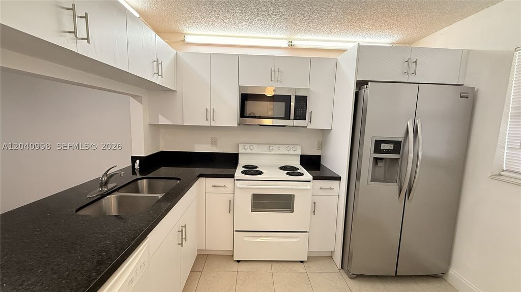 Photo of 9262 NW 1st St #205, Pembroke Pines, FL 33024 (MLS # A12040998)