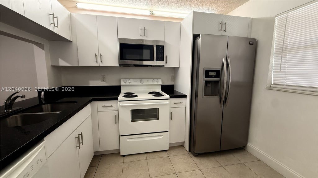 Photo of 9262 NW 1st St #205, Pembroke Pines, FL 33024 (MLS # A12040998)