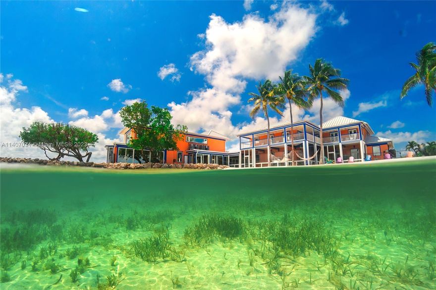 Magnificent Private Sugarloaf Estate! Truly one-of-a-kind trophy property boasting 10 beds 11 baths nestled on 4.5 acres of pristine oceanfront land, surrounded on 3 sides by emerald & sapphire crystal-clear waters, this property is a private compound in paradise & only 20 minutes to Key West. This estate features a private 75ft wide white sandy beach, waterfrontage on 3 sides totaling an incredible 1700 FT. From every vantage point, the expansive open water views are simply breathtaking, making this rare point lot between 2 canals an unrivaled gem. This property has incredible development potential & could be used as a corporate retreat or private compound. Secluded & offering utmost privacy, this estate is completely fenced with an electric gate.
