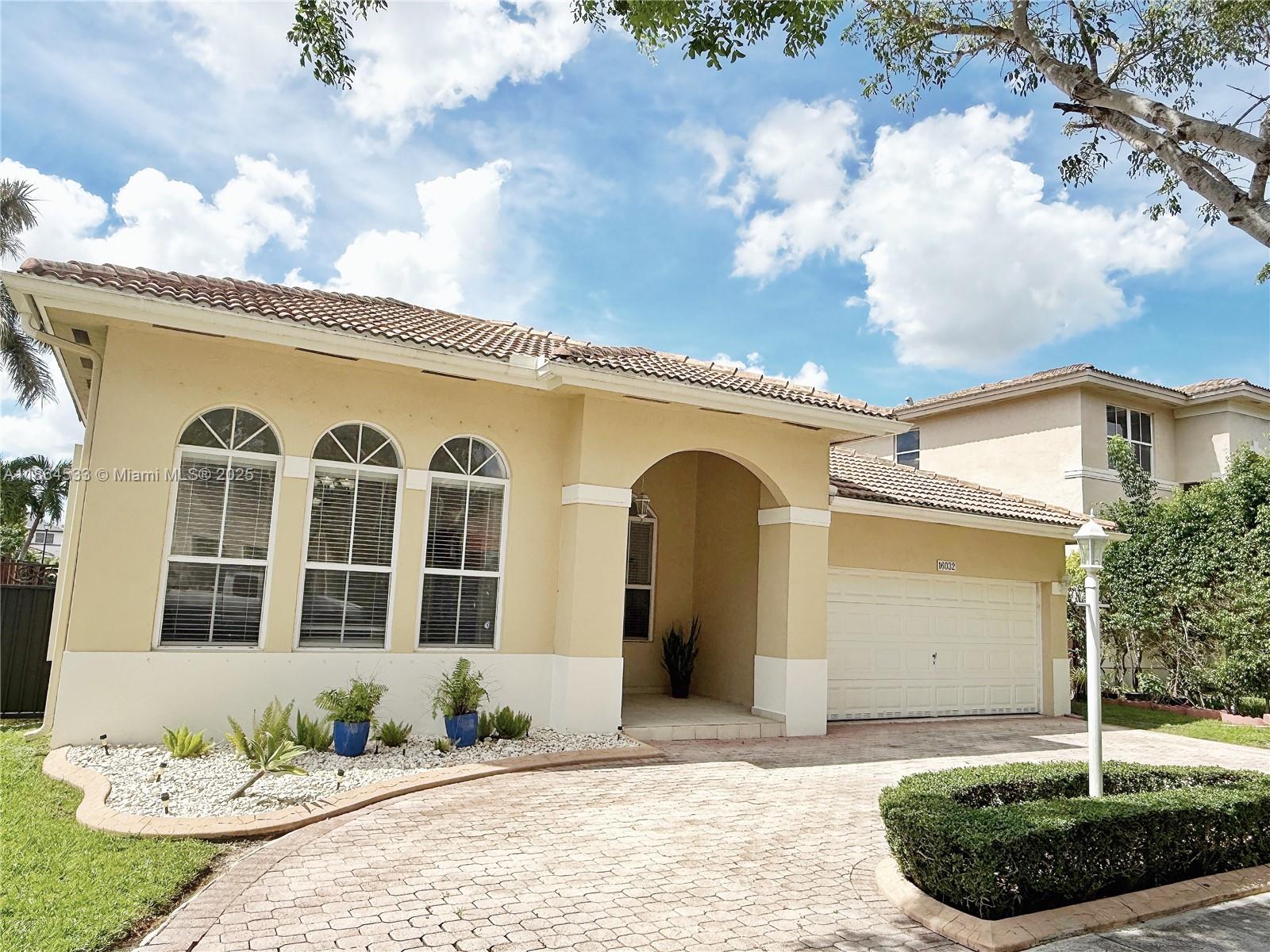 Step into this beautiful very well maintained home in a quiet community on a tree lined street. Enjoy water view from the family room, master bedroom and terrace. Open and spacious layout featuring a split bedroom floor plan for privacy. Very large closet and master bathroom featuring shower and tub. Eat in kitchen with breakfast nook and stainless steal appliances. Completely tiled for easy maintenance, freshly painted with plenty of natural light. Accordion shutters for hurricane protection. This home is in turnkey condition ready for a family to call it home. Low HOA Fee. Very close to excellent restaurants and shopping. This one is a MUST SEE and priced to sell.