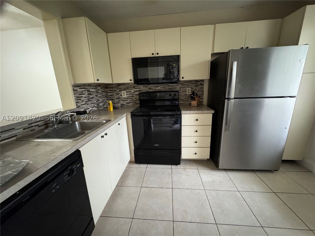 Photo of 7760 NW 50th St #107, Lauderhill, FL 33351 (MLS # A12091420)