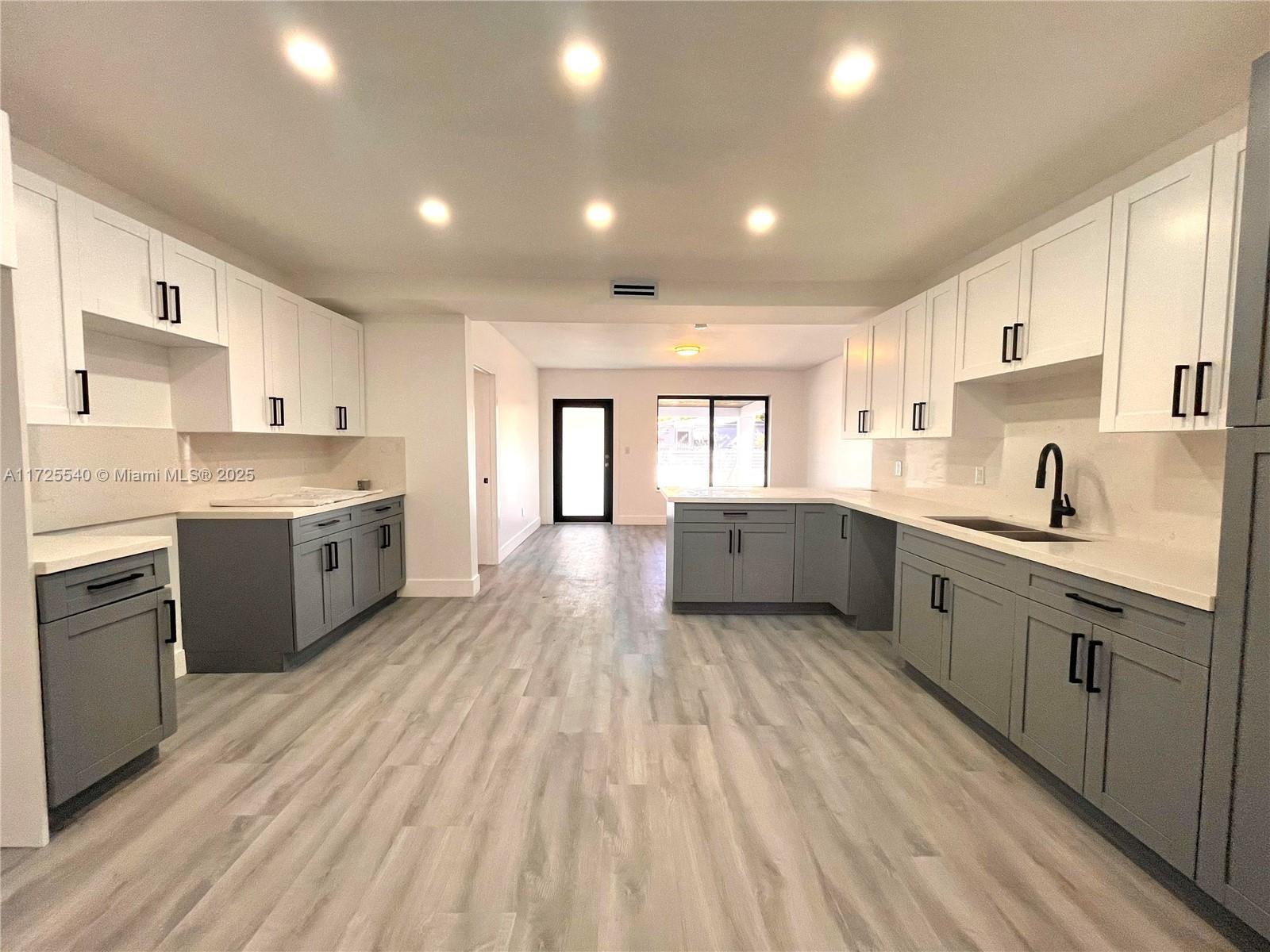 STUNNING UPGRADED HOME !!! WELCOME TO YOUR DREAM HOME. THIS HOME BOASTS ABUNDANT NATURAL LIGHTING. 3 BEDROOMS 3 BATHROOMS,NEWER KITCHEN WITH QUARTZ COUNTERTOPS,NEW APPLIANCES,FEATURES INCLUDE : Â CROWN MOLDING & BASEBOARDS THROUGHOUT, NEW LAMINATED WATER PROOF VINYL FLOORS THROUGHOUT, BONUS DEN/OFFICE OR 4TH BEDROOM, NEWER HURRICANE IMPACT WINDOWS & DOOR, FOR FULL HURRICANE PROTECTION,OUTSIDE BIG BACKYARD WITH FRUIT TREES .