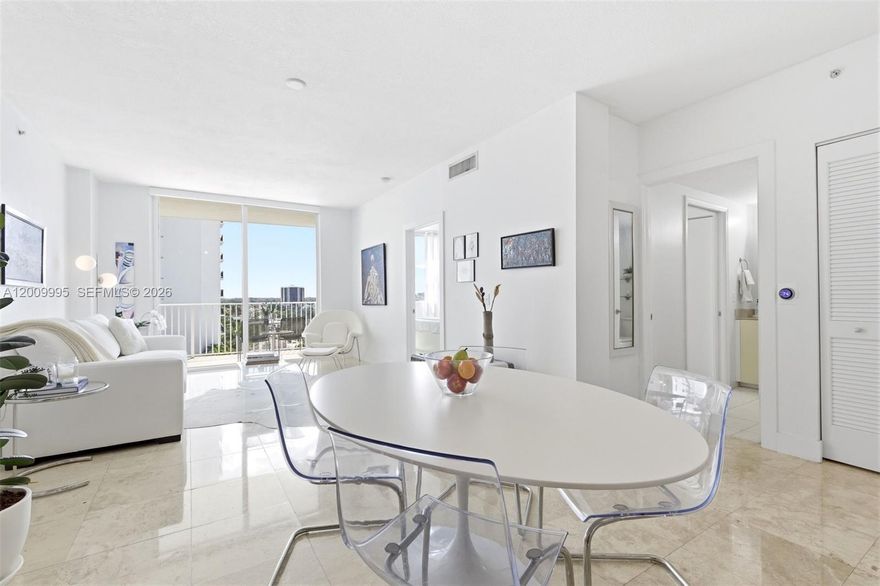 Sophisticated 9th-floor residence at Midtown Lofts, where urban energy meets residential ease in one of Miami’s most connected locations. Nestled along the Coral Way corridor between Downtown Coral Gables and Brickell, with quick access to Coconut Grove, Key Biscayne, Miami International Airport and major thoroughfares, this light-filled home offers both beauty and convenience. Designed by its owner, a professional designer with exquisite taste, the residence features hurricane-impact windows, travertine marble floors, natural kitchen counter tops and an east-facing balcony with sweeping city and pool views framed by a lush green canopy of trees. Midtown Lofts offers desirable amenities including a pool deck, fitness center, sauna, concierge/security, controlled access and enclosed parking with one assigned & covered space. A bright, stylish city retreat with architectural soul.