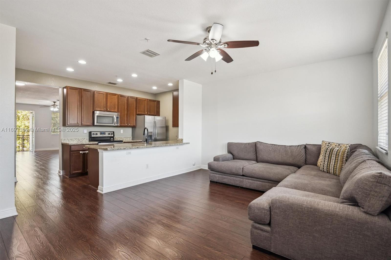Modern 2BR/2.5BA tri-level townhouse in Cobblestone next to the community pool and park. This spacious, move-in-ready townhouse offers the perfect blend of luxury and convenience. Located in a prestigious gated community, the versatile floor plan features two large living areas, open kitchen with stainless steel appliances, 42" wood cabinets and granite countertops, and generously sized bedrooms with en-suite bathrooms. Enjoy hardwood floors, French doors, open balcony, walk-in closet, and convenient upstairs washer/dryer. Residents have access to exceptional amenities, including a fitness center, playground, and clubhouse. Close to I-75, Whole Foods, shopping malls, and restaurants. In a top-rated school district and investor-friendly with leasing allowed. Don't miss this $uper buy!