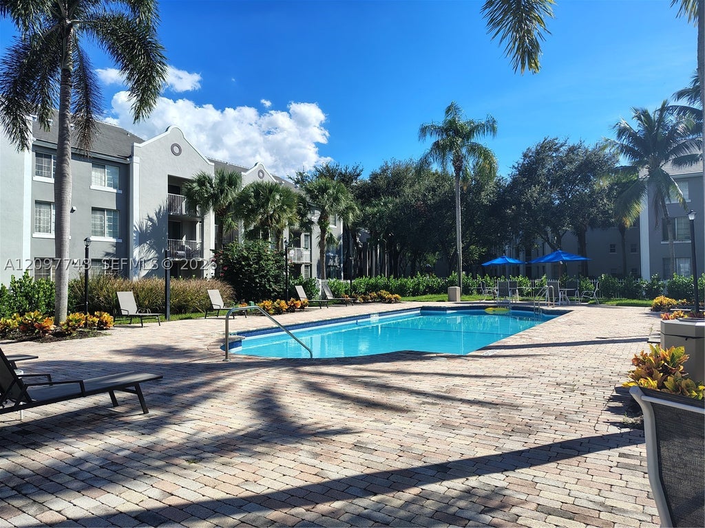 Photo of 577 SW 111th Ln #204, Pembroke Pines, FL 33025 (MLS # A12097743)