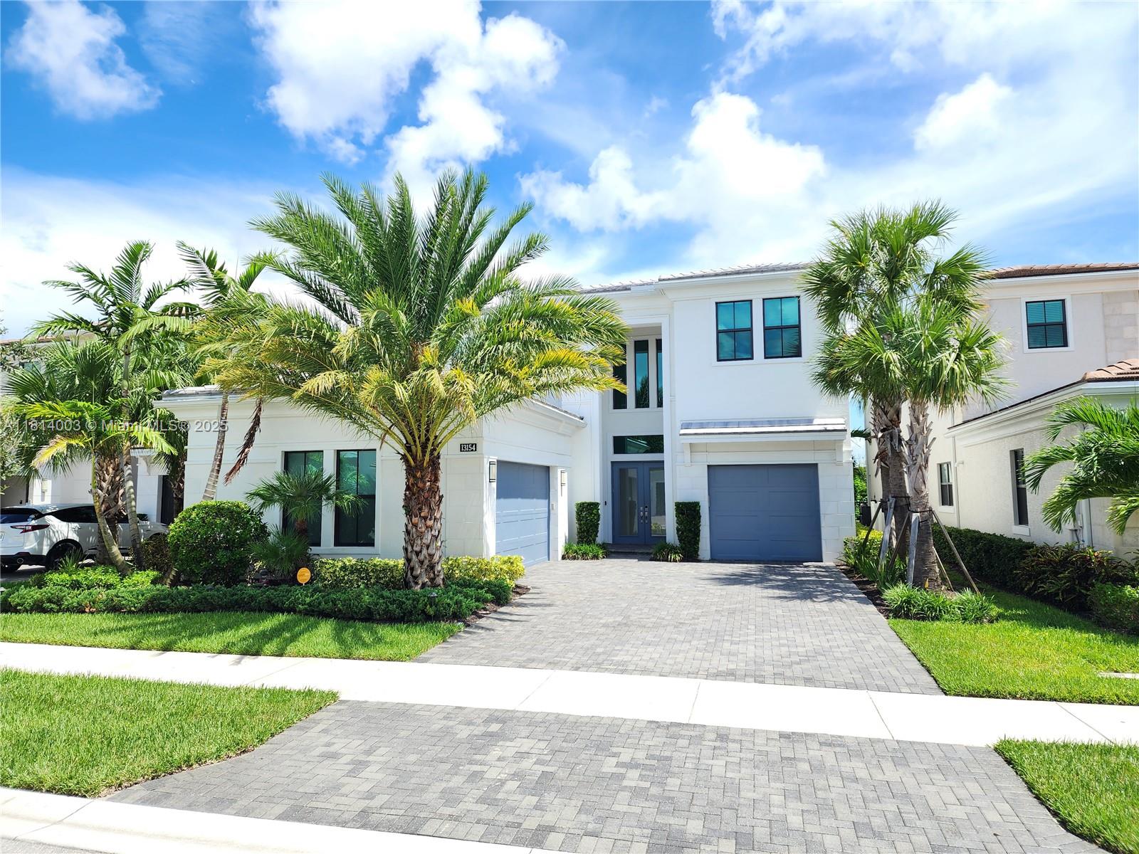 This stunning, spacious home has a water and sunrise view. Very few homes at this price can compare. It's in a Beautiful New Gated community with modern amenities. Located just north of PGA National and west of Juno Beach, it's a golfer/beachgoer paradise.