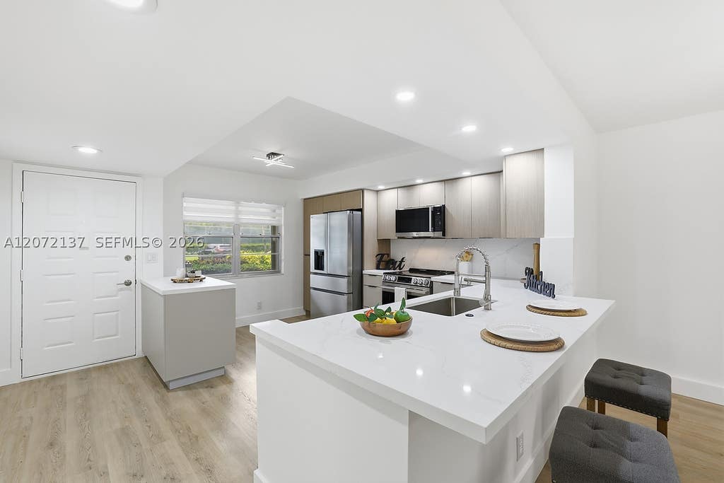 Photo of 300 SW 130th Ter #110B, Pembroke Pines, FL 33027 (MLS # A12072137)