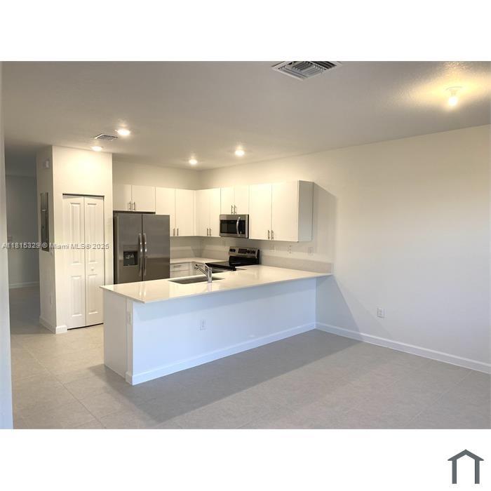 12131 NW 23rd Ct .
