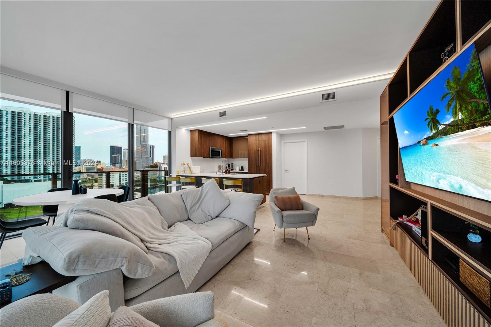 Elegant and roomy corner unit, rare in the heart of Brickell, with 3 beds and 3 1/2 bathrooms. The modern look is completed by italian kitchen & bath cabinetry with white quartz counter tops, built-in large walk-in custom-made closets for all three bedrooms and marble floors. Walk-in kitchen pantry brings an additional space and convenience. Updated and upgraded with custom made LED lighting across all the unit. Two parking spaces and complementary valet service available. Wrap-around wide terrace. Located on top of Brickell City Center, with direct access to the mall. Furniture and art can be negotiated to be included in the sale.
Outdoor fitness areas, fitness center, spa with treatment rooms, lounge, movie theater, pool, running track and kids’ playground are the included amenities.