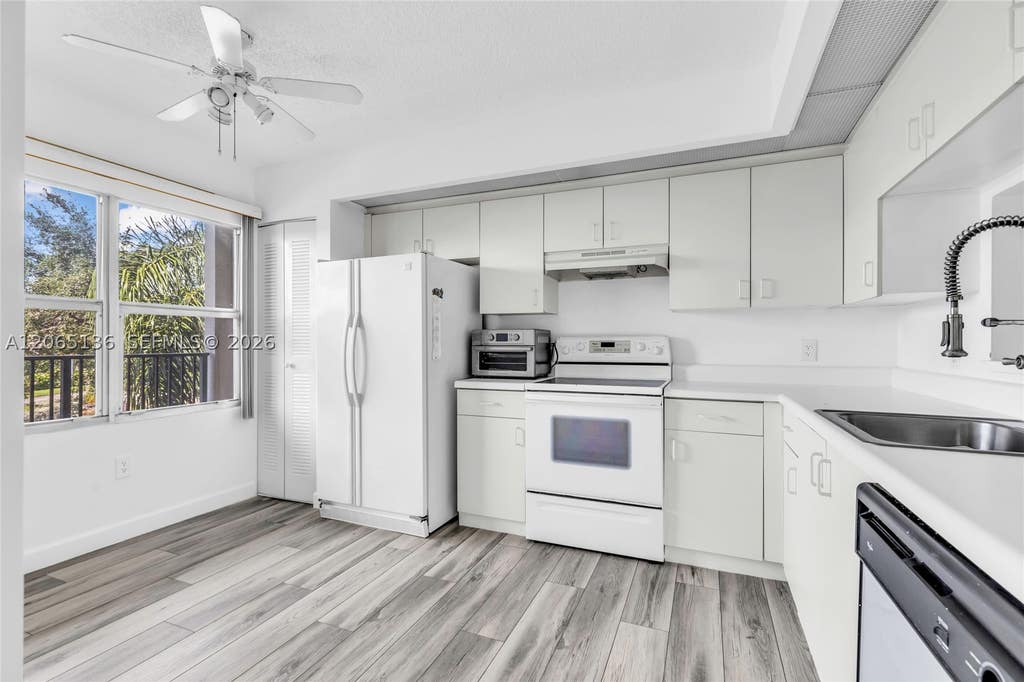 Photo of 550 SW 138th Ave #309K, Pembroke Pines, FL 33027 (MLS # A12065136)