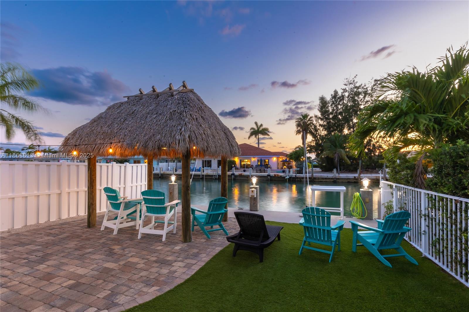 Welcome to your Key Colony Beach Escape, a beautifully maintained 3-bedroom, 2-bathroom waterfront half duplex featuring all-new impact windows and doors, 30 feet of concrete dockage, a fish cleaning station, tiki hut, fresh paint, new furnishings, and smart televisions in every room. The open-concept living area seamlessly integrates with a fully equipped kitchen, complete with a breakfast bar and dining area for six. This turnkey investment opportunity includes over $30,000 in future bookings to be transferred and active vacation rental licenses. Residents enjoy exclusive access to the nearby Cabana Club, offering beach and pool privileges, and the property is conveniently situated near parks, fishing, golf, and fine dining within the highly desirable Key Colony Beach community.