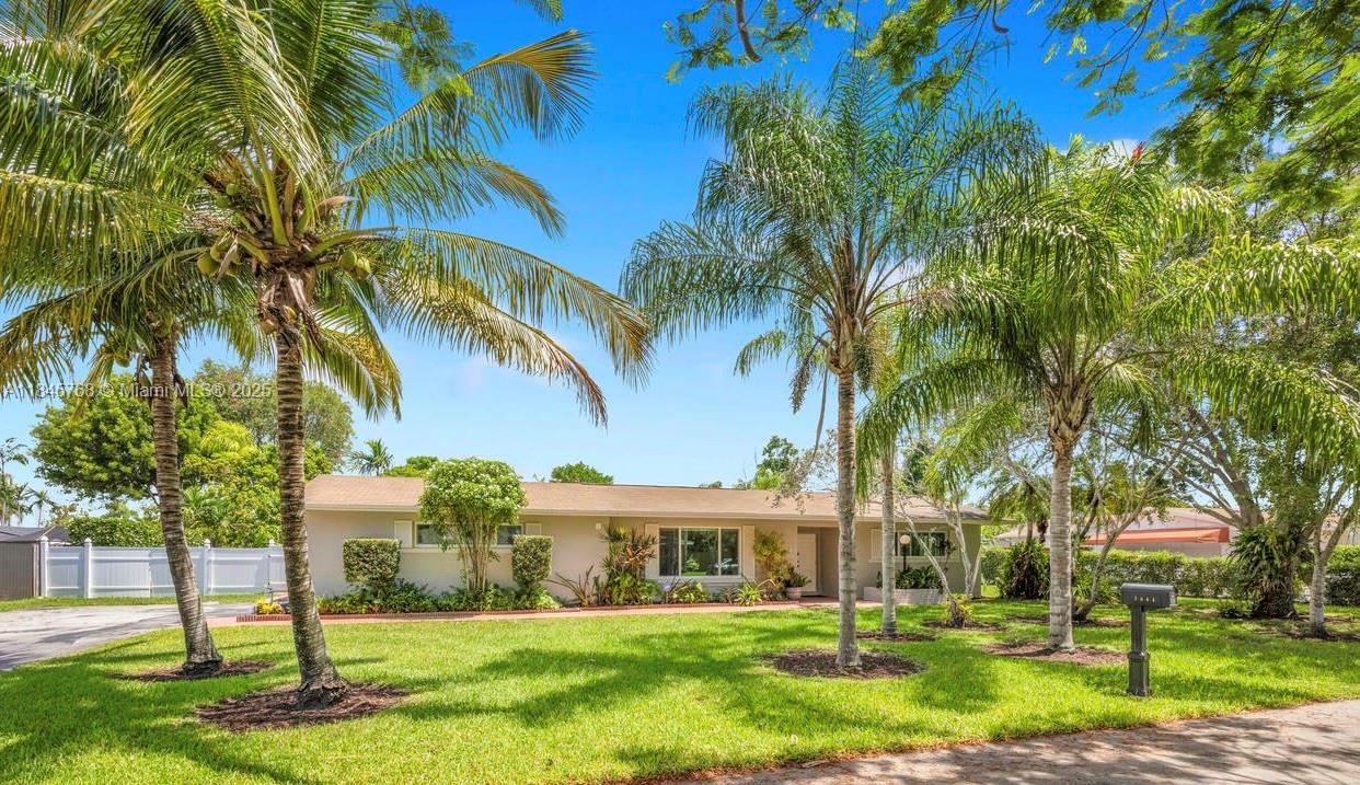 Tucked away on a quiet street, this beautifully cared-for 4-bedroom, 3-bathroom home sits on an expansive 15,000+ SqFt lot. This spacious residence offers a functional split floor plan, generous living areas including living, dining, and family room. The large open kitchen is perfect for entertaining. Enjoy the large, fully fenced private backyard, complete w/ a pool and mature mango tree. Space in the front and side yard for a garden or outdoor sports. 1.5 car garage, EV charging station, ample storage, and impact windows throughout. 2 bedrooms are en-suite, the 4th is perfect for a home office.This home will check all your boxes! Located minutes from top-rated schools, The Falls, parks, and major highways. Rare opportunity in a fantastic Miami neighborhood. You are going to love it here!