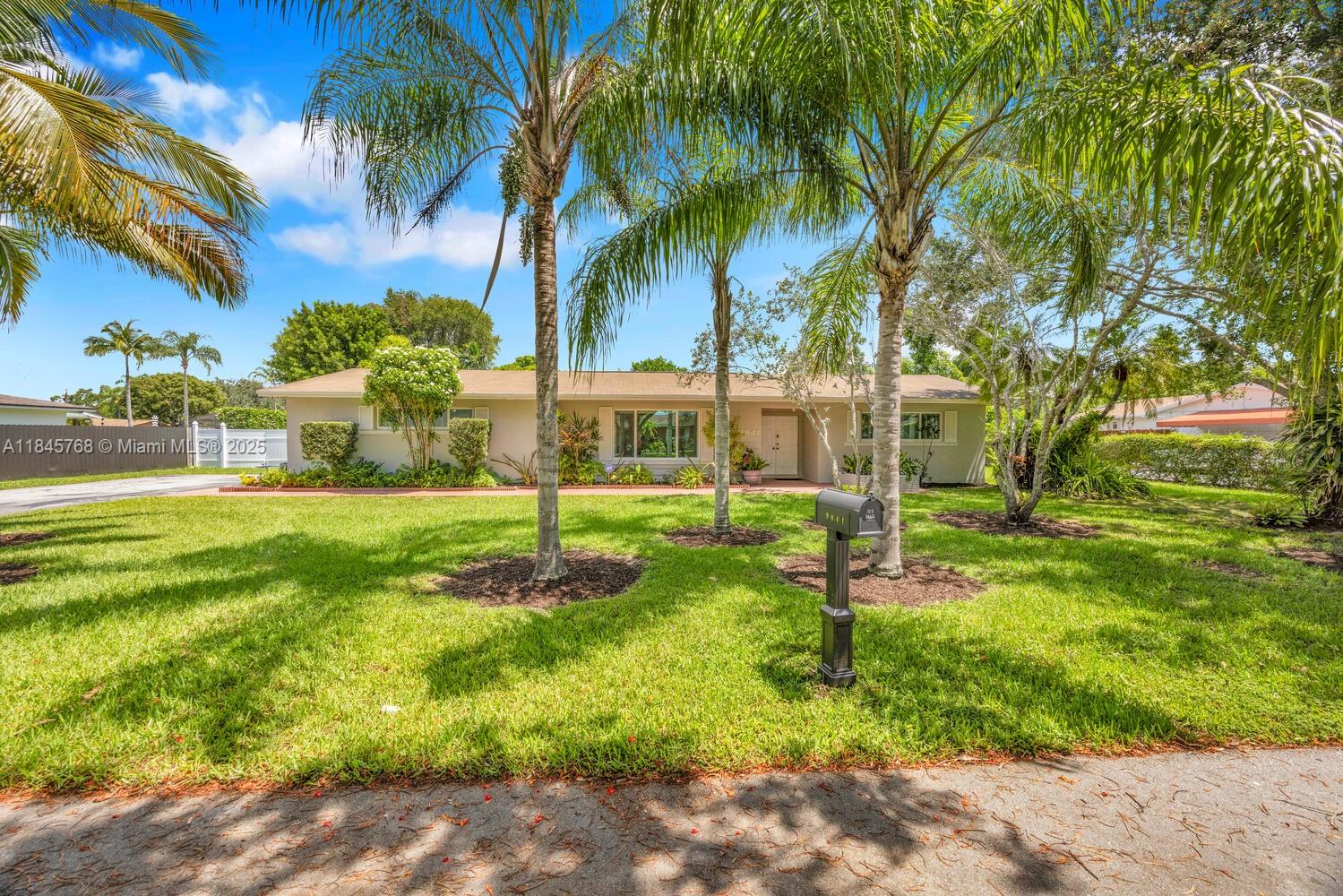 Tucked away on a quiet street, this beautifully cared-for 4-bedroom, 3-bathroom home sits on an expansive 15,000+ SqFt lot. This spacious residence offers a functional split floor plan, generous living areas including living, dining, and family room with a large open kitchen ideal for entertaining. Enjoy the lush, fully fenced private backyard, complete with a pool and mature mango tree. Screened back patio and very large front and side yard- ready for a beautiful garden or some fun outside sports! 2-car garage, EV charging station, ample storage, and impact windows throughout. Located minutes from top-rated schools, The Falls, parks, and major highways. Rare opportunity in one of Miami’s most desirable neighborhoods. You are going to love it here!