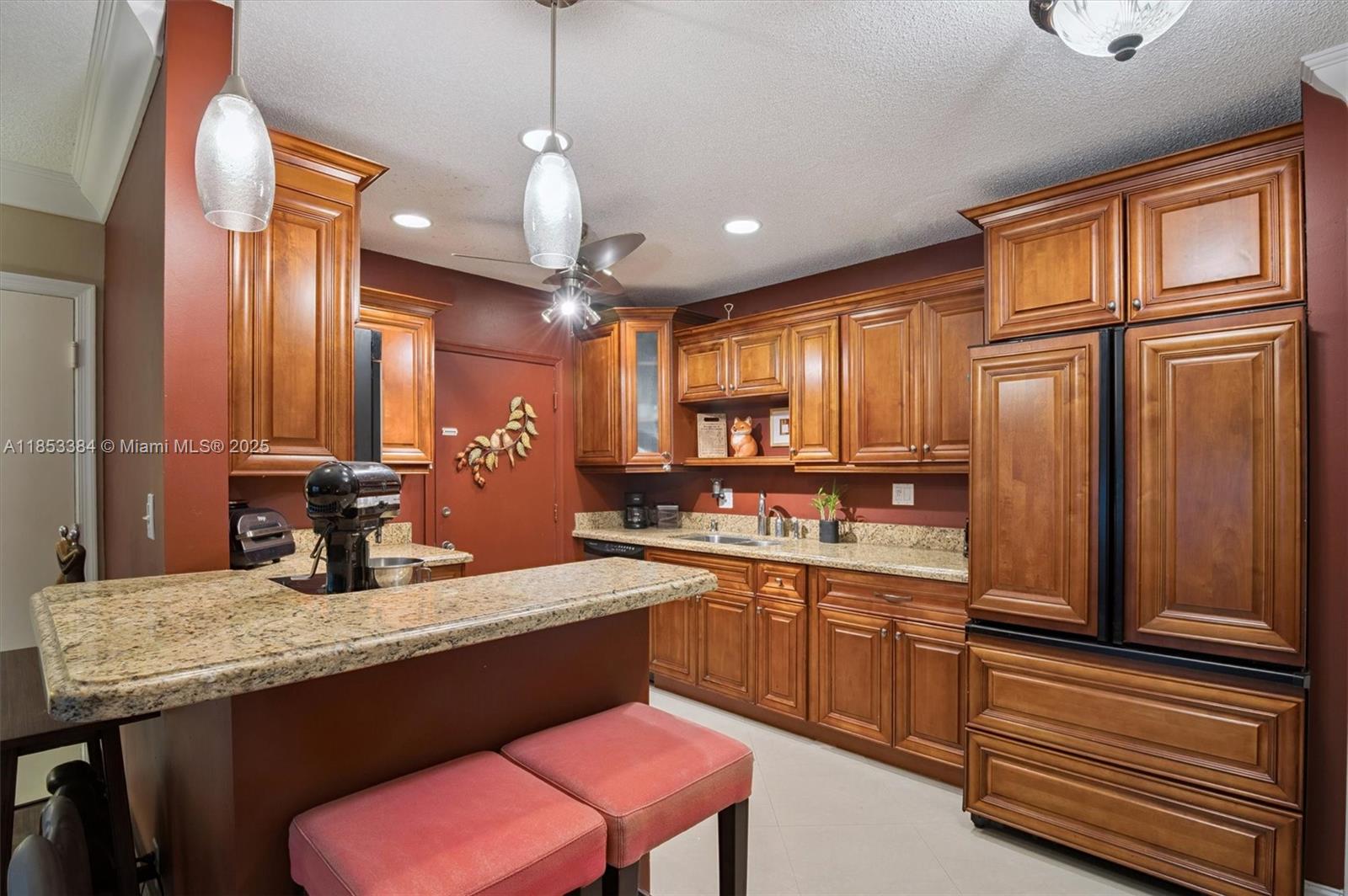 Welcome to your beautifully renovated 2 bedroom, 1.5 bath garden condo. This space features a gourmet kitchen adorned with beautiful wood cabinetry, granite countertops, and stainless steel appliances, complete with a convenient breakfast bar—perfect for casual dining. Enjoy the sleek ceramic tile flooring and crown molding, enhancing the condo's airy ambiance. Impact windows ensure safety and energy efficiency while allowing natural light to fill the rooms. Located in a vibrant community close to pristine beaches, shopping, and the lively Fort Lauderdale lifestyle, this condo is the ideal retreat for those seeking comfort and convenience. Building has a new roof, updated clubhouse, kitchen facilities, heated pool, BBQ, assigned parking and laundry facilities.