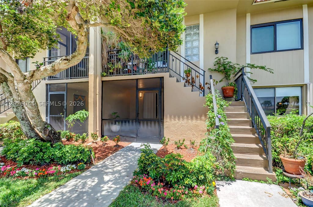 Photo of 302 Lakeview Dr #105, Weston, FL 33326 (MLS # A12026044)