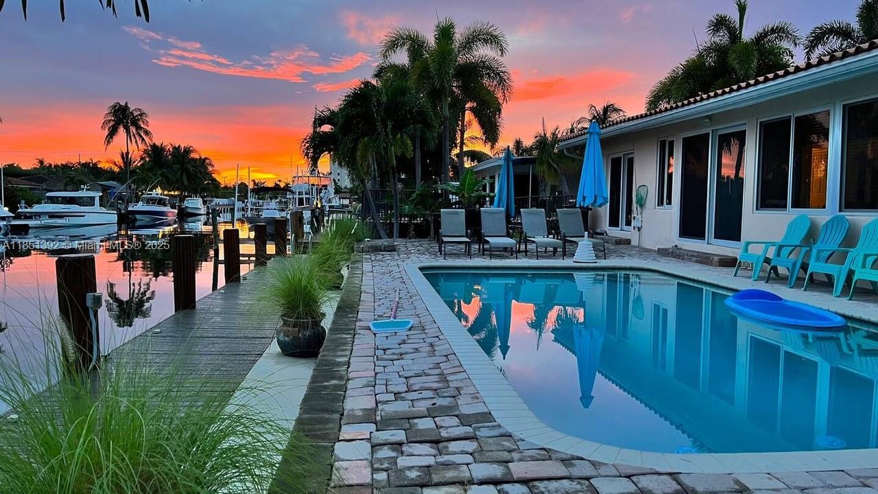 Experience the best of waterfront living in this beautifully maintained 3-bedroom, 2-bath plus additional office room. Home offering 75 feet of deepwater frontage with no fixed bridges, just minutes to the ocean. This inviting residence features high-impact windows and doors, a whole-house generator with transfer switch for peace of mind. The open-concept floor plan is filled with natural light and flows seamlessly over elegant neutral tile floors, capturing refreshing ocean breezes throughout the day. Enjoy the convenience of a fully equipped dock with power and water. Can be rented furnished , partially furnished or unfurnished.