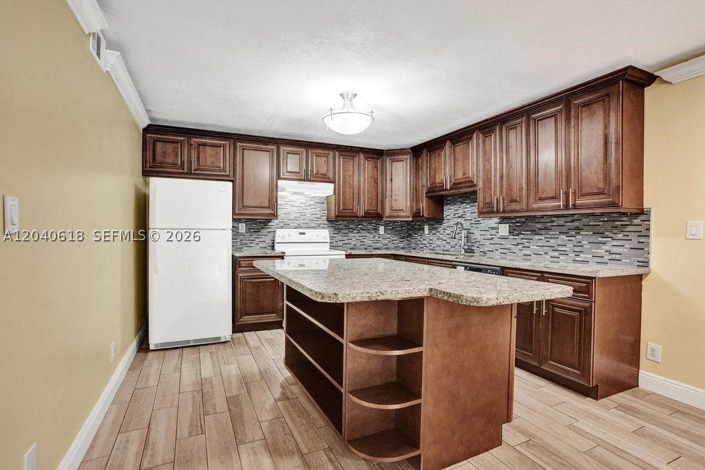 Photo of 4114 NW 88th Ave #102, Coral Springs, FL 33065 (MLS # A12040618)