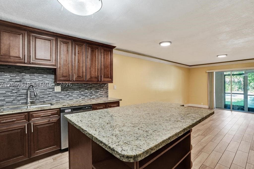Photo of 4114 NW 88th Ave #102, Coral Springs, FL 33065 (MLS # A12040618)