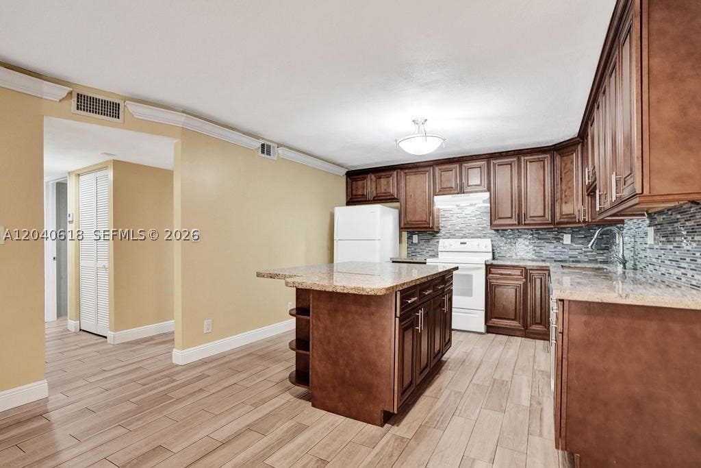 Photo of 4114 NW 88th Ave #102, Coral Springs, FL 33065 (MLS # A12040618)