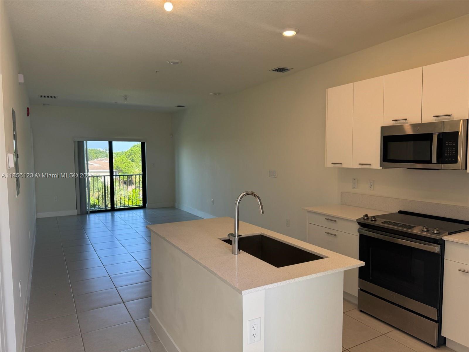 stunning 1-bedroom, 1-bath condo at Urbana in Downtown Doral. Built in 2023, this third-floor residence offers 738 sqft of modern living space, featuring sleek porcelain floors, a spacious kitchen island, and in-unit washer/dryer. Enjoy your morning coffee on the private balcony, or step outside to a vibrant boulevard filled with restaurants, bars, and shops.