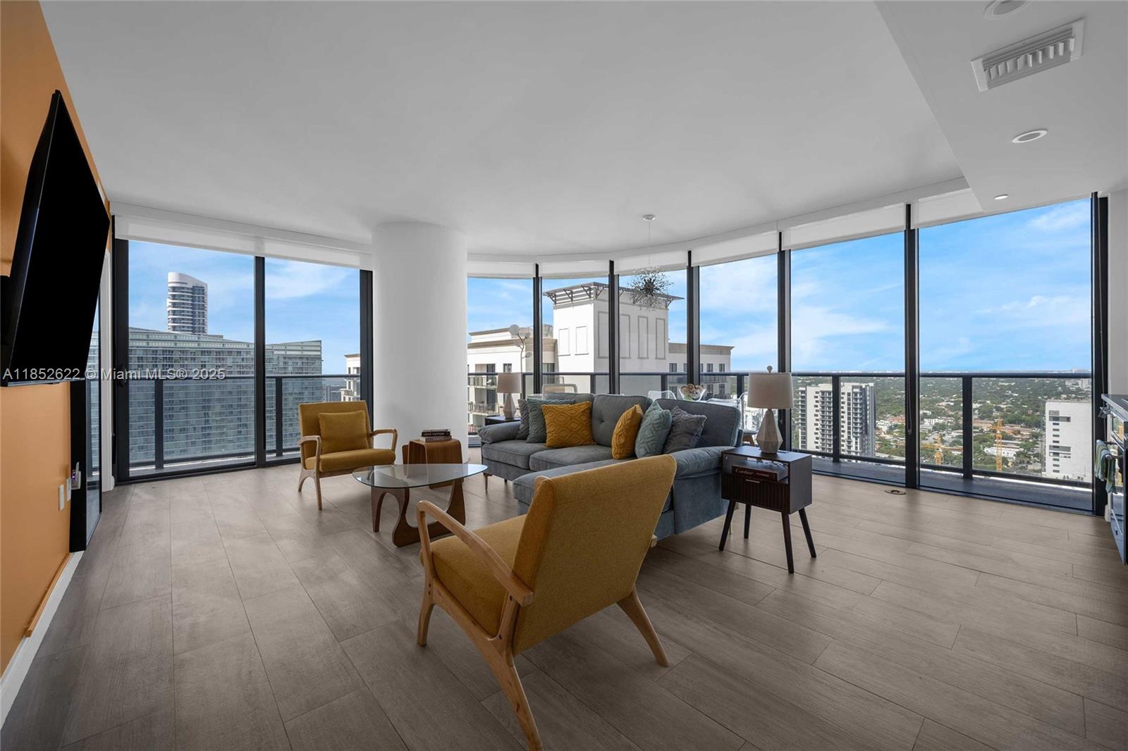 Experience stunning sunrise-to-sunset views from this fully furnished, high-floor corner residence in the heart of Brickell. This 2-bedroom + den, 2-bathroom unit offers 1,053 SF of modern living space with a spacious split floor plan, floor-to-ceiling impact windows, and wraparound balcony. Move-in ready and fully equipped — includes glassware, tableware, cookware, silverware, and all essentials. Just bring your suitcase. The primary suite features a king-size bed and a spa-style bathroom with soaking tub, walk-in shower, and double vanity. Interior highlights include European cabinetry, GE Monogram appliances, imported porcelain tile floors, and 9' ceilings. Residents enjoy resort-style amenities including a rooftop sky pool,full-service spa with sauna, steam room, and jacuzzi.