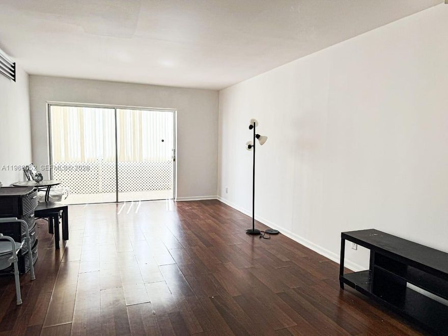 Welcome to Majestic Gardens. This spacious 2 bedroom 1.5 bath unit offers comfort and value. This bright unit features laminate wood flooring throughout. The unit design features a Florida room with vertical blinds and screens. The kitchen has wifi enabled outlets. Condo fees are amount the lowest in the area. This property is an excellent opportunity for homeowners and investors alike.